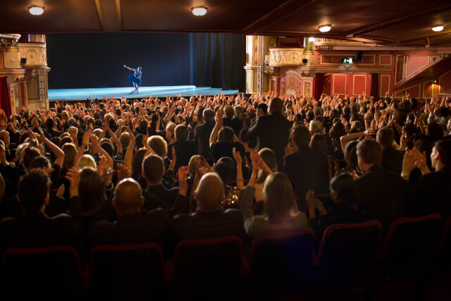 Audience clapping in theatre at event in Norfolk 