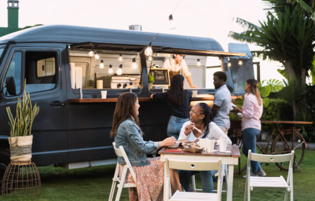 People eating street food outdoors