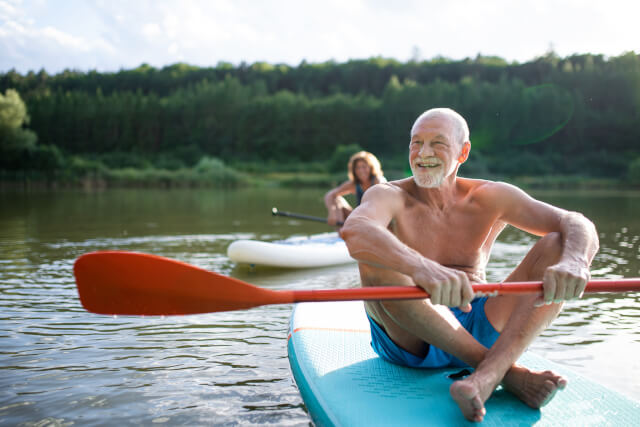 Senior couple paddle boarding, things to do in Norfolk